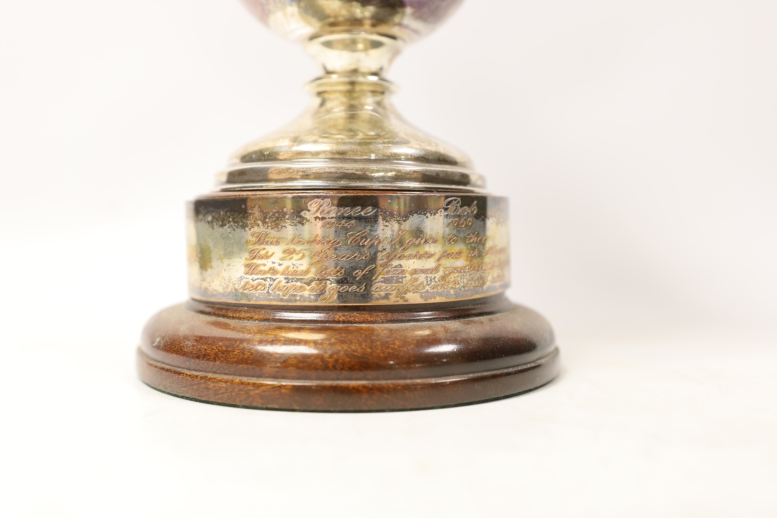 A George V tri handled silver presentation cup, T. Wilkinson & Sons, Birmingham, 1923, height, 18.9cm, 15.1oz, on a circular socle.